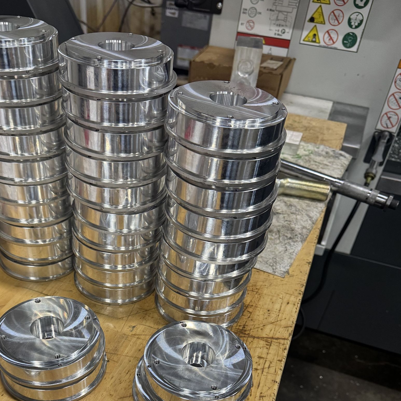 Stacks of machined aluminum disc housings