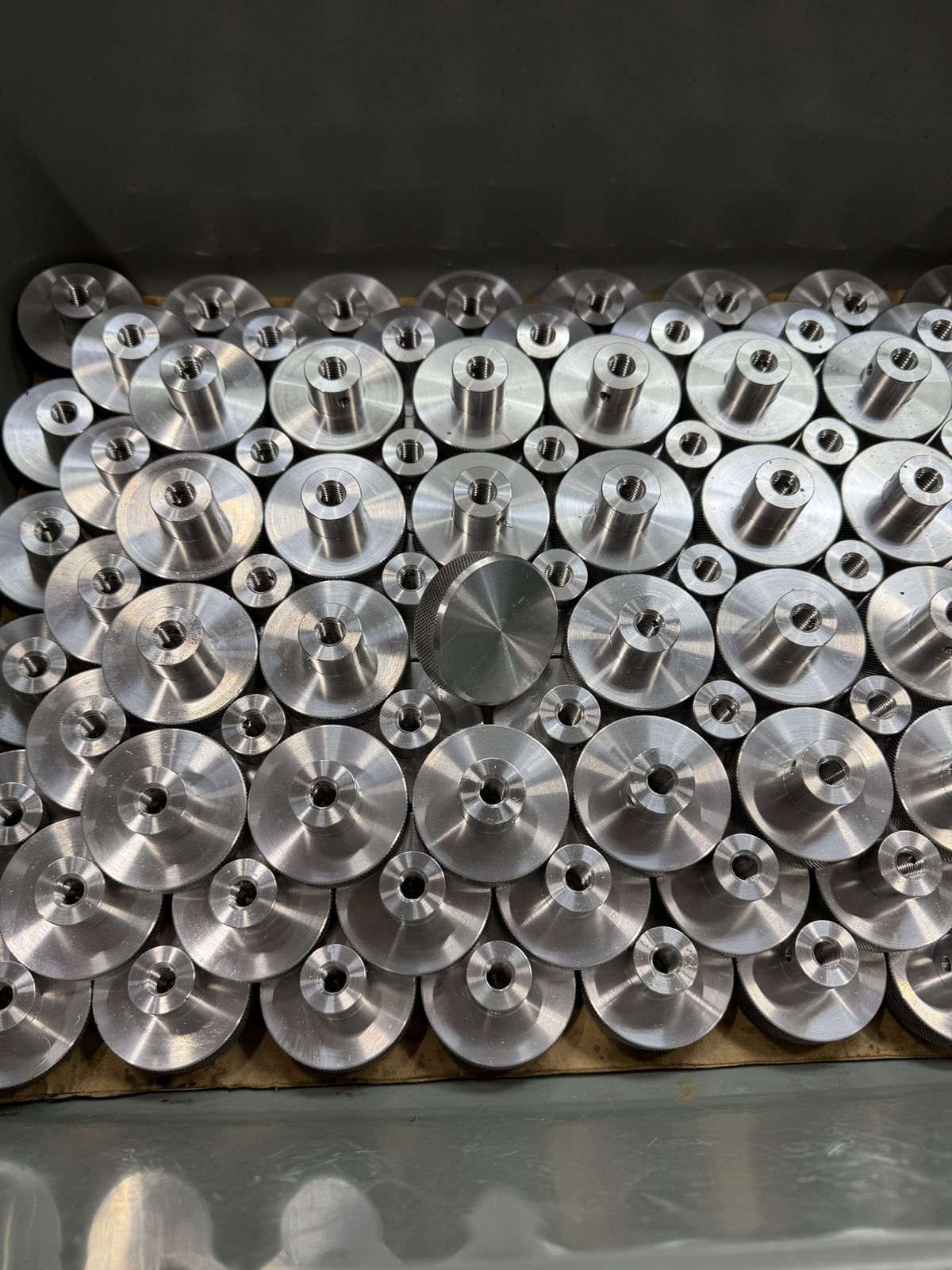 Bin of finished knurled aluminum parts