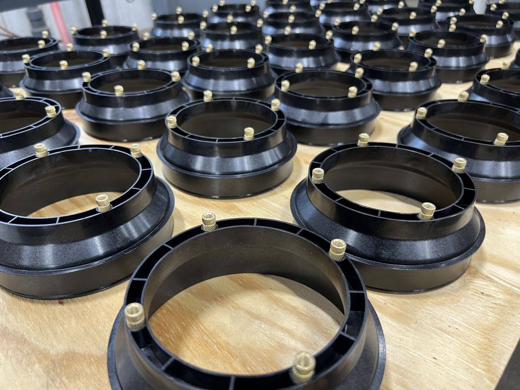 A production run of black molded rings